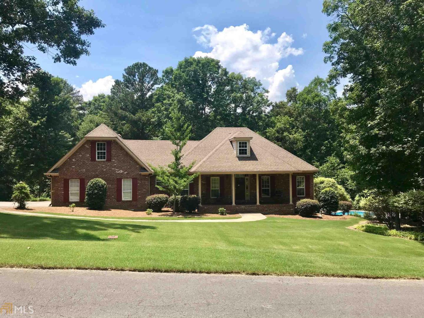 303 Rustic Ridge Road Northeast Rome, GA 30161 - Photo 1 of 1 a front view of a house with a yard