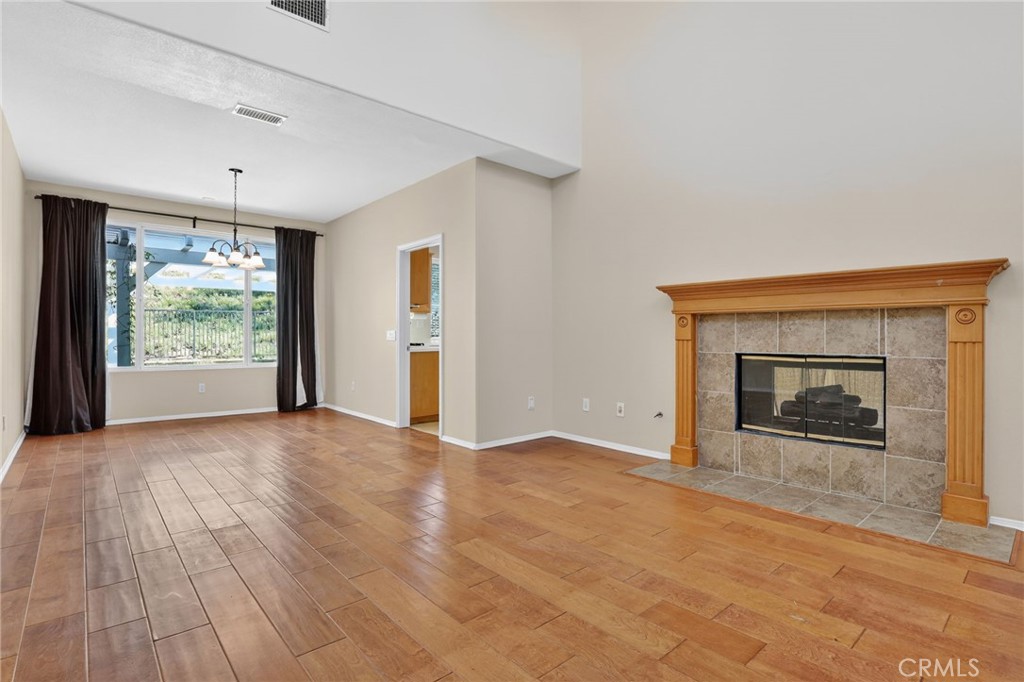 20543 Pesaro Porter Ranch Porter Ranch, CA 91326 - Photo 10 of 67 a view of an empty room with a fireplace and a window