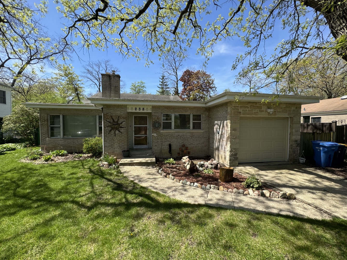 238 Ridge Road Highland Park, IL 60035 - Photo 3 of 5 a view of house with yard outdoor seating and covered with trees