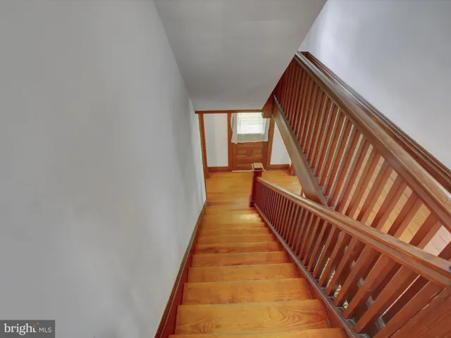 a view of balcony with wooden floor