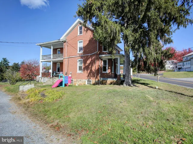 a view of backyard with green space