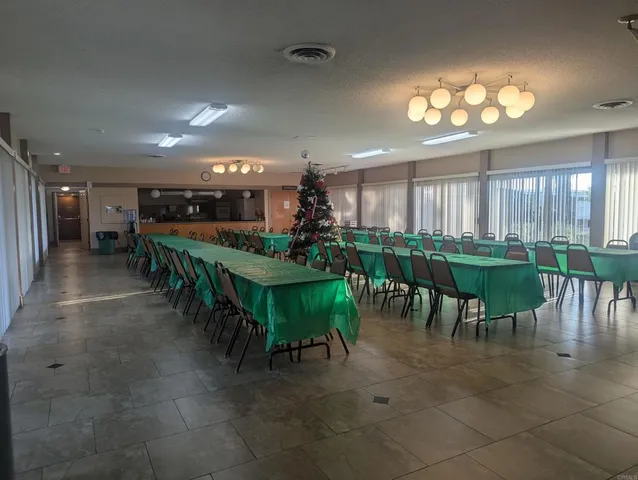 a kitchen with stainless steel appliances granite countertop a sink and a stove