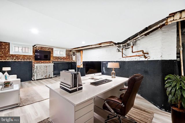 a dinning table and chairs in a kitchen