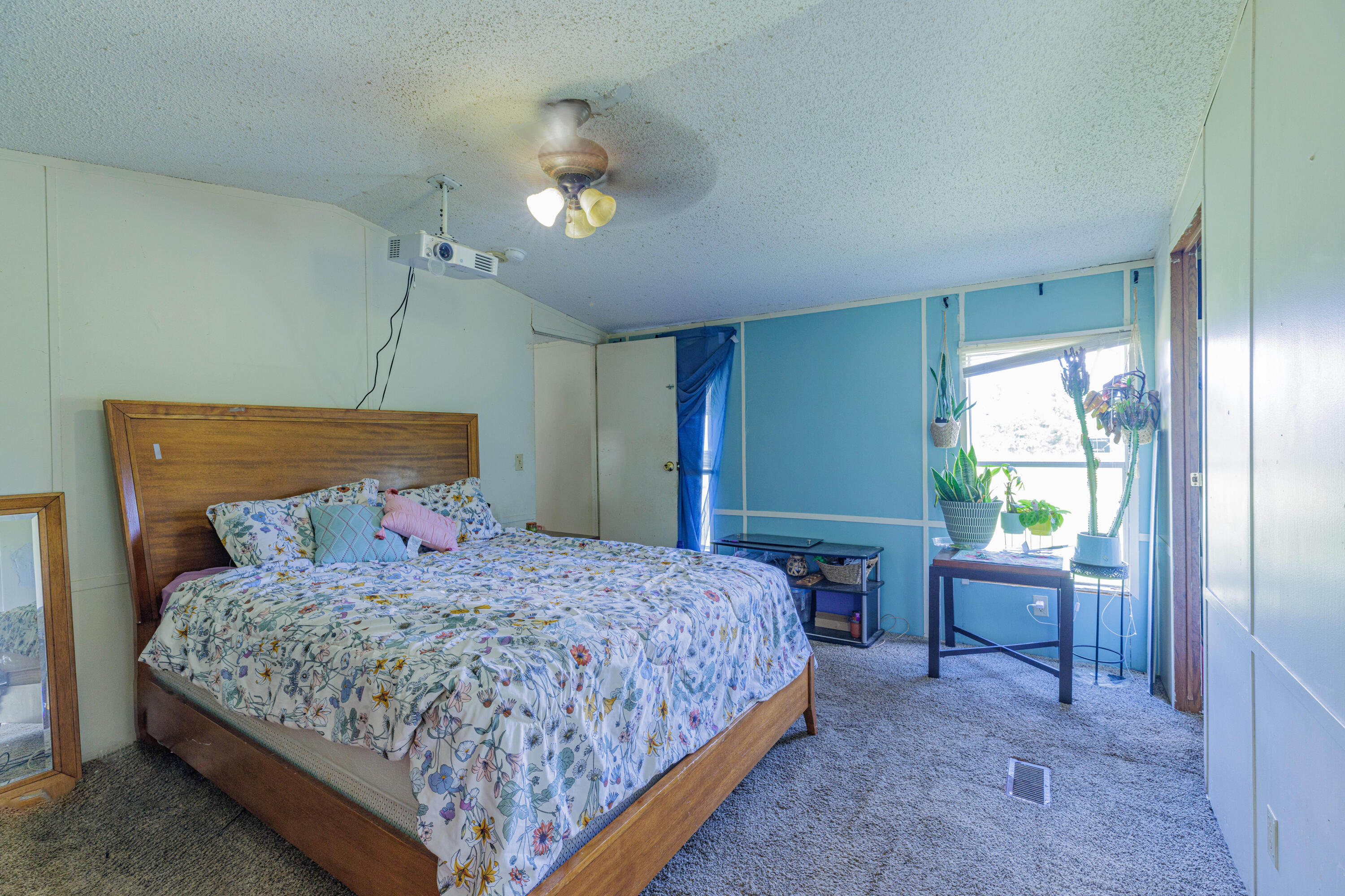 6337 Sherman Kennedy Road Baker, FL 32531 - Photo 11 of 17 a bedroom with a bed lamps and furniture