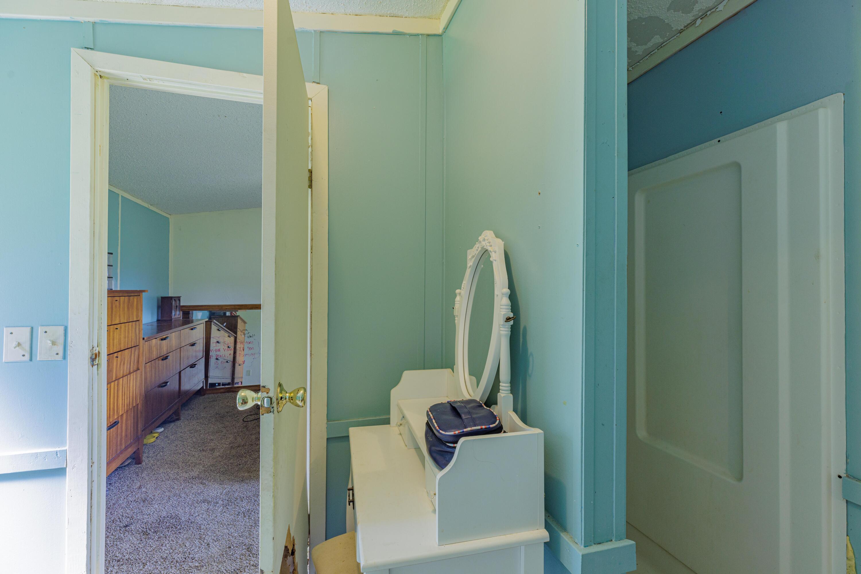 6337 Sherman Kennedy Road Baker, FL 32531 - Photo 13 of 17 a view of a bathroom from a hallway