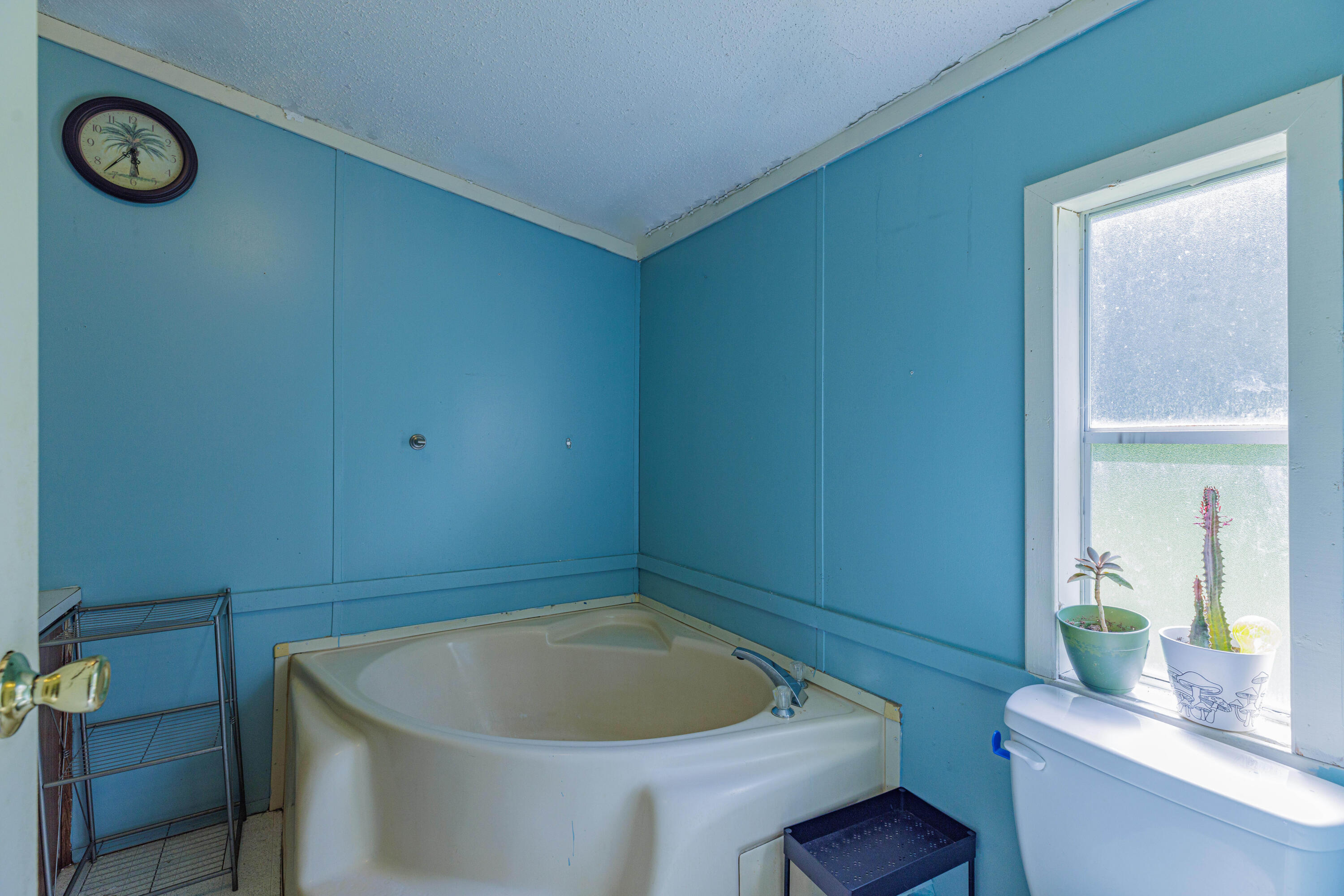 6337 Sherman Kennedy Road Baker, FL 32531 - Photo 14 of 17 a bathroom with a sink and a toilet