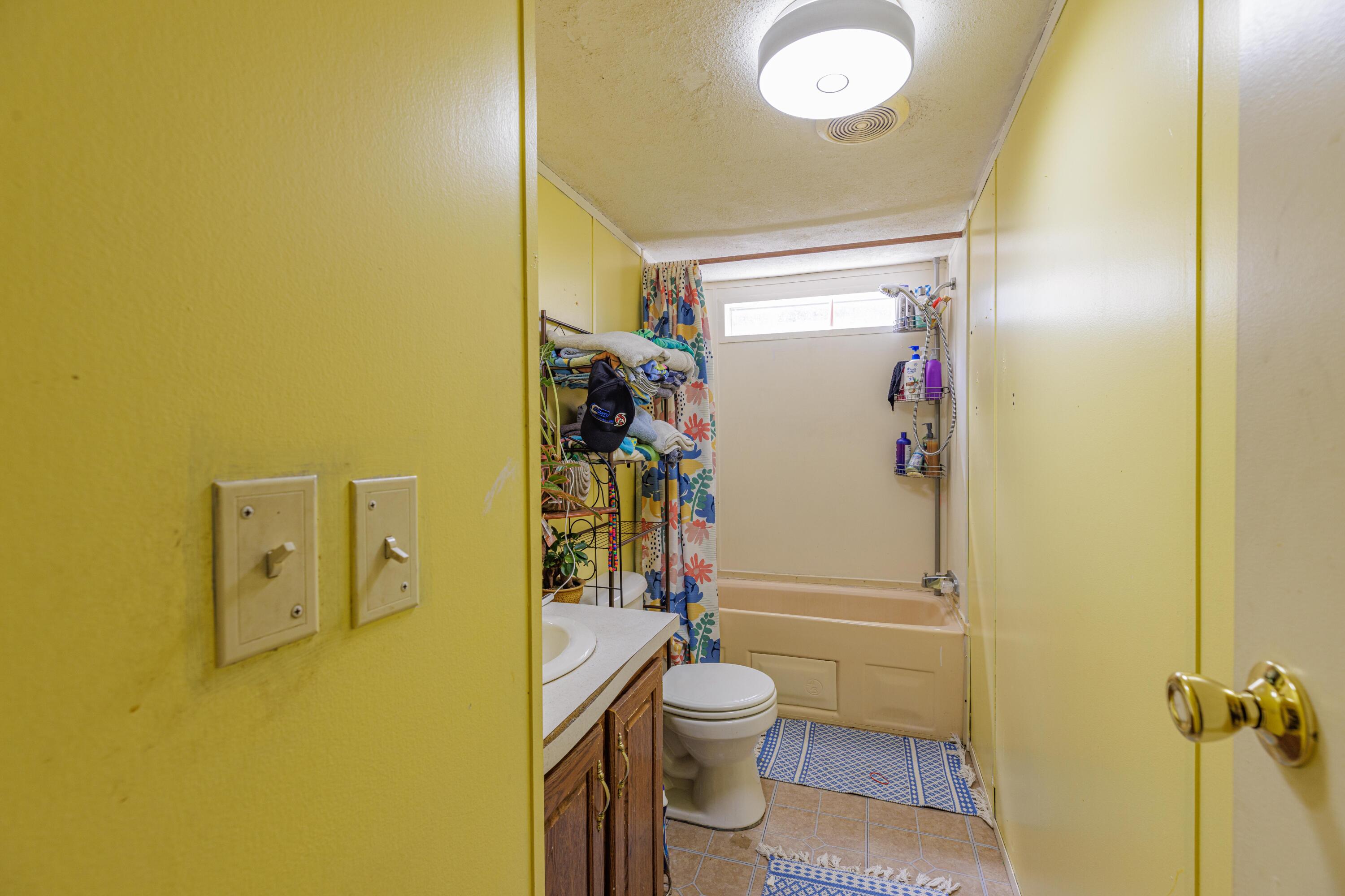 6337 Sherman Kennedy Road Baker, FL 32531 - Photo 16 of 17 a bathroom with a sink and toilet