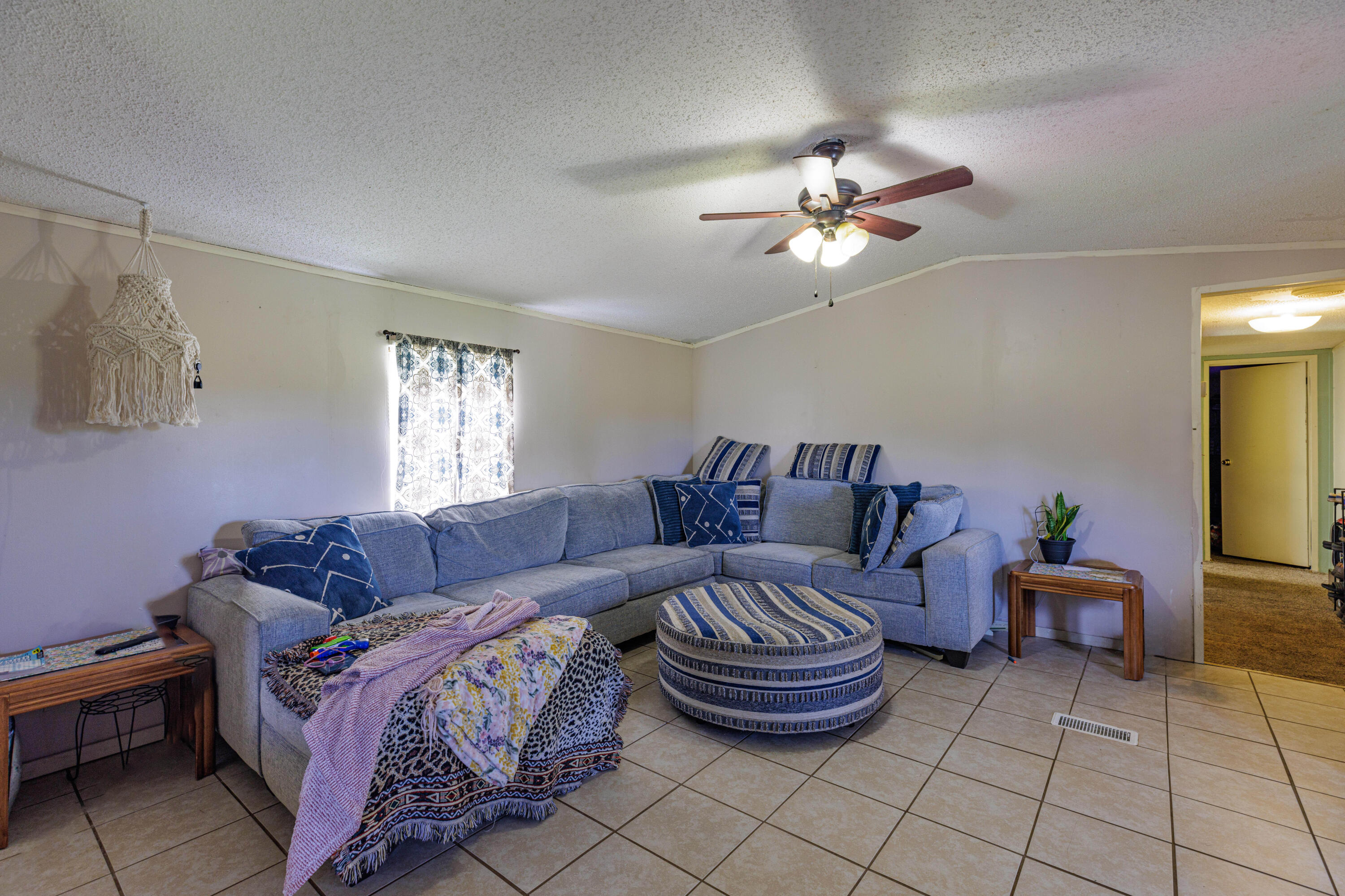 6337 Sherman Kennedy Road Baker, FL 32531 - Photo 5 of 17 a living room with furniture and a chandelier