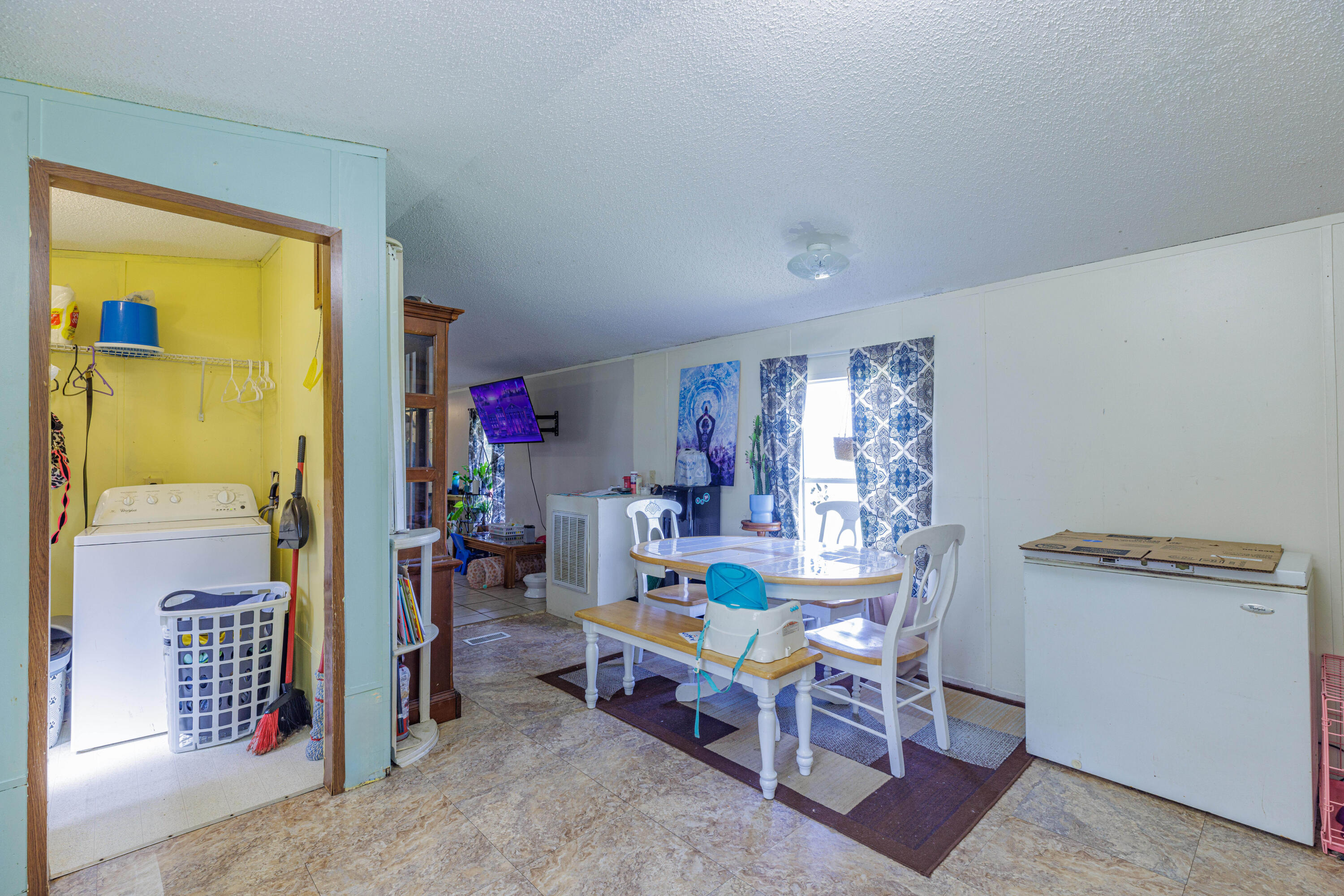 6337 Sherman Kennedy Road Baker, FL 32531 - Photo 7 of 17 a view of a workspace with furniture and a window