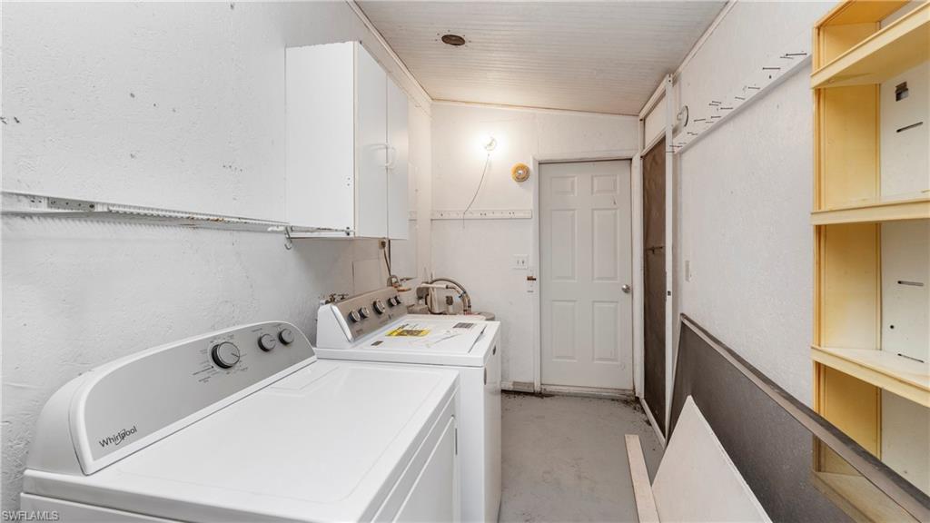 171 Grassy Key Lane Naples, FL 34114 - Photo 15 of 25 a utility room with dryer and washer