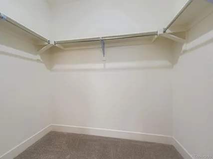 a view of an empty walk in closet
