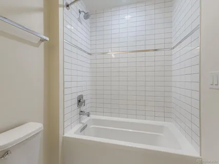 a bathroom with a shower and a bathtub