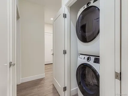 a view of a hallway with washer and dryer