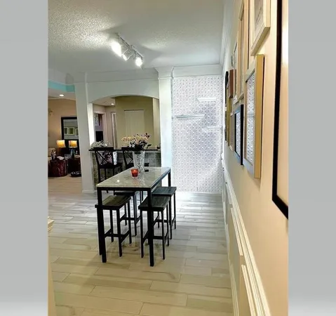 a dining room with furniture and wooden floor