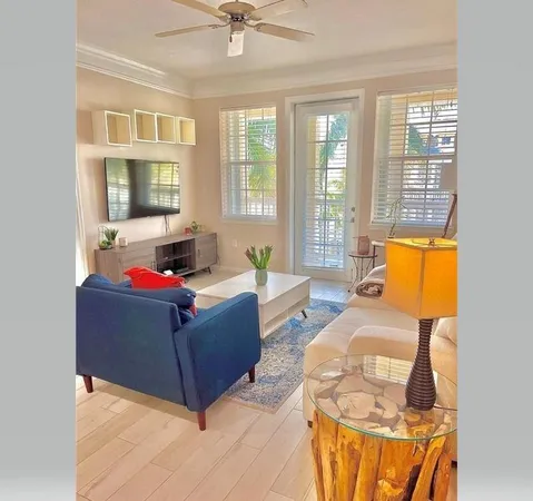 a living room with furniture and windows