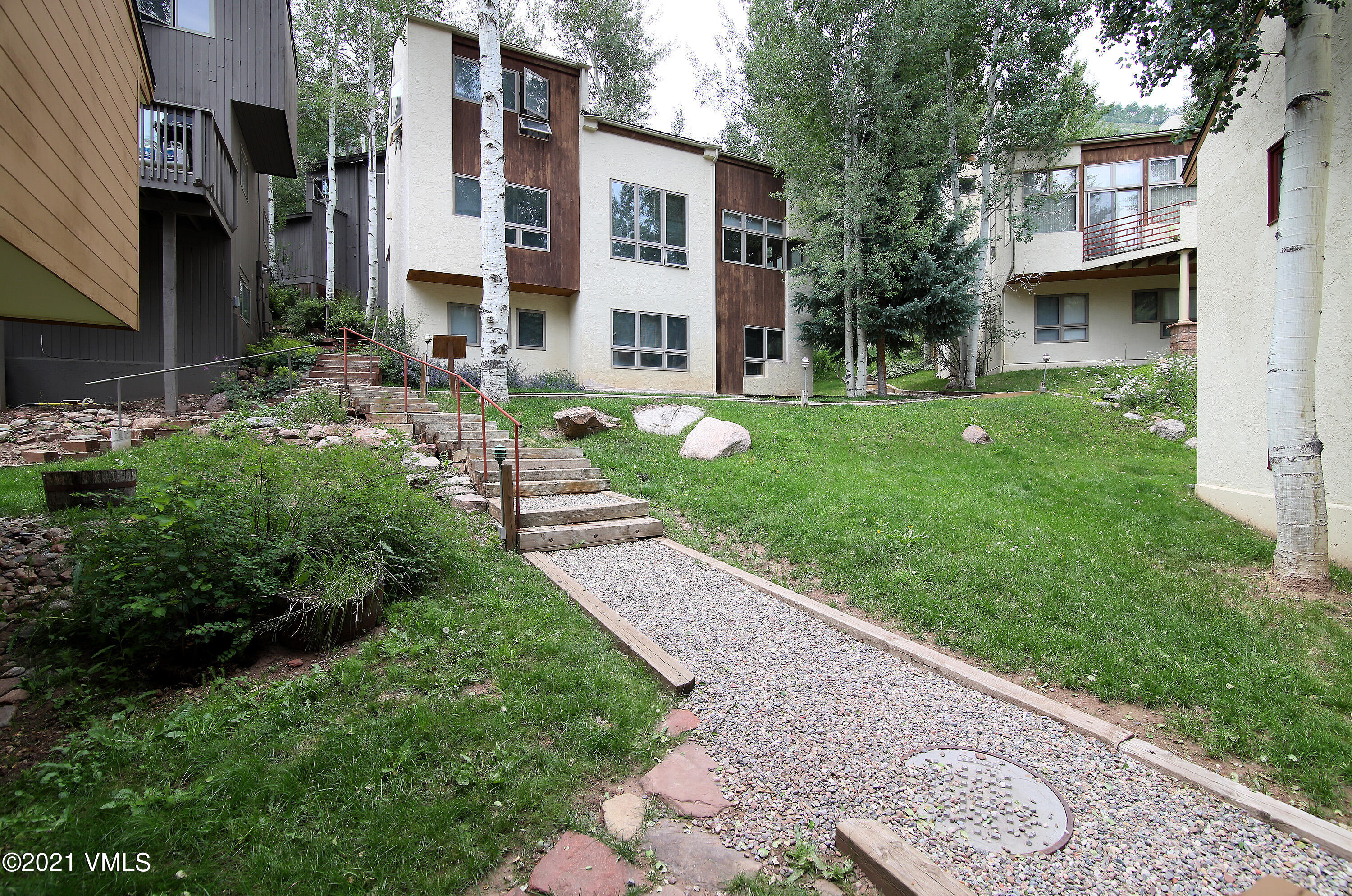 1480 Buffehr Creek Road, Unit 3A Vail, CO 81657 - Photo 14 of 17 a view of a house with a yard