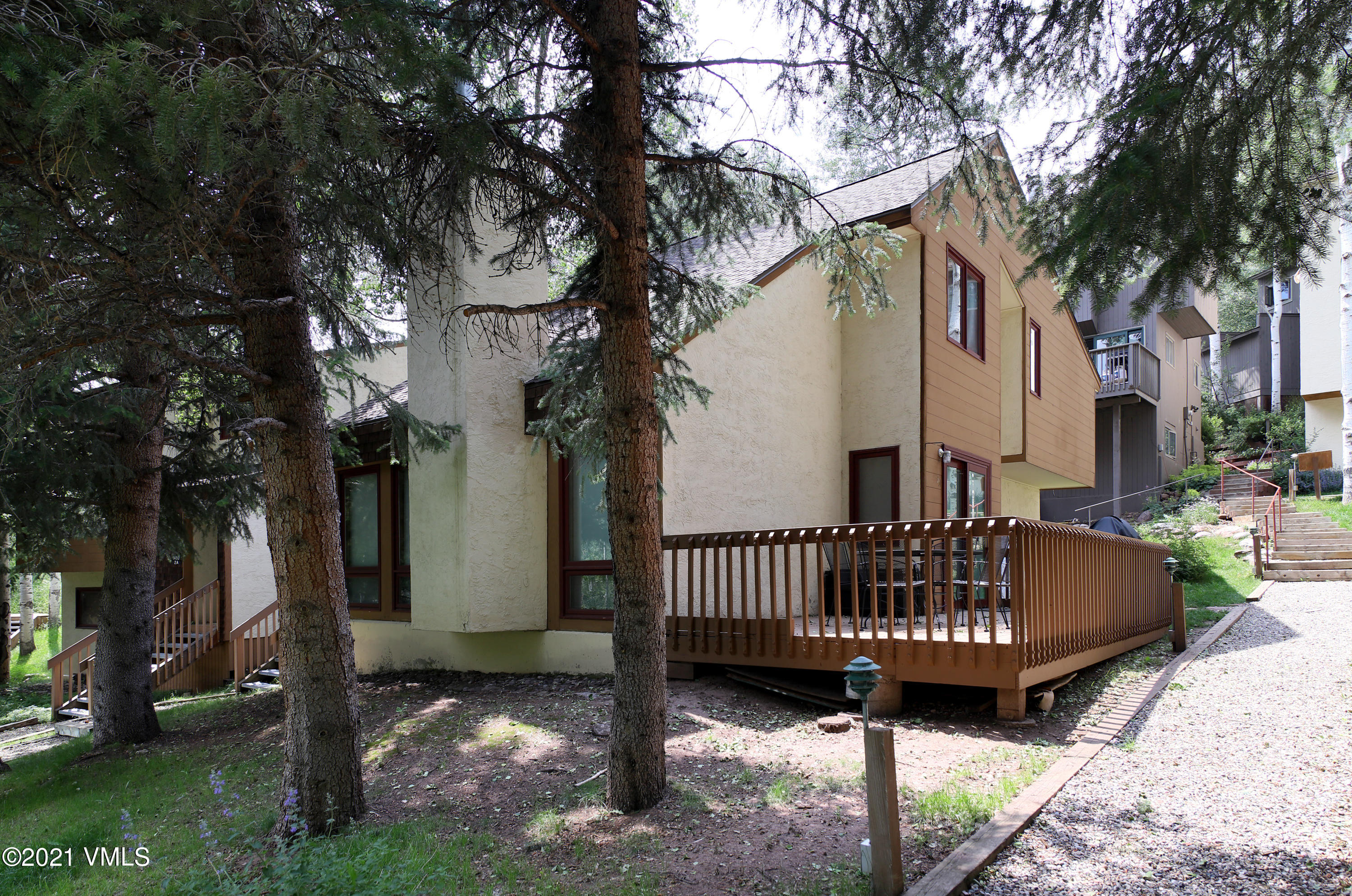 1480 Buffehr Creek Road, Unit 3A Vail, CO 81657 - Photo 15 of 17 a view of a chair and table in backyard of the house