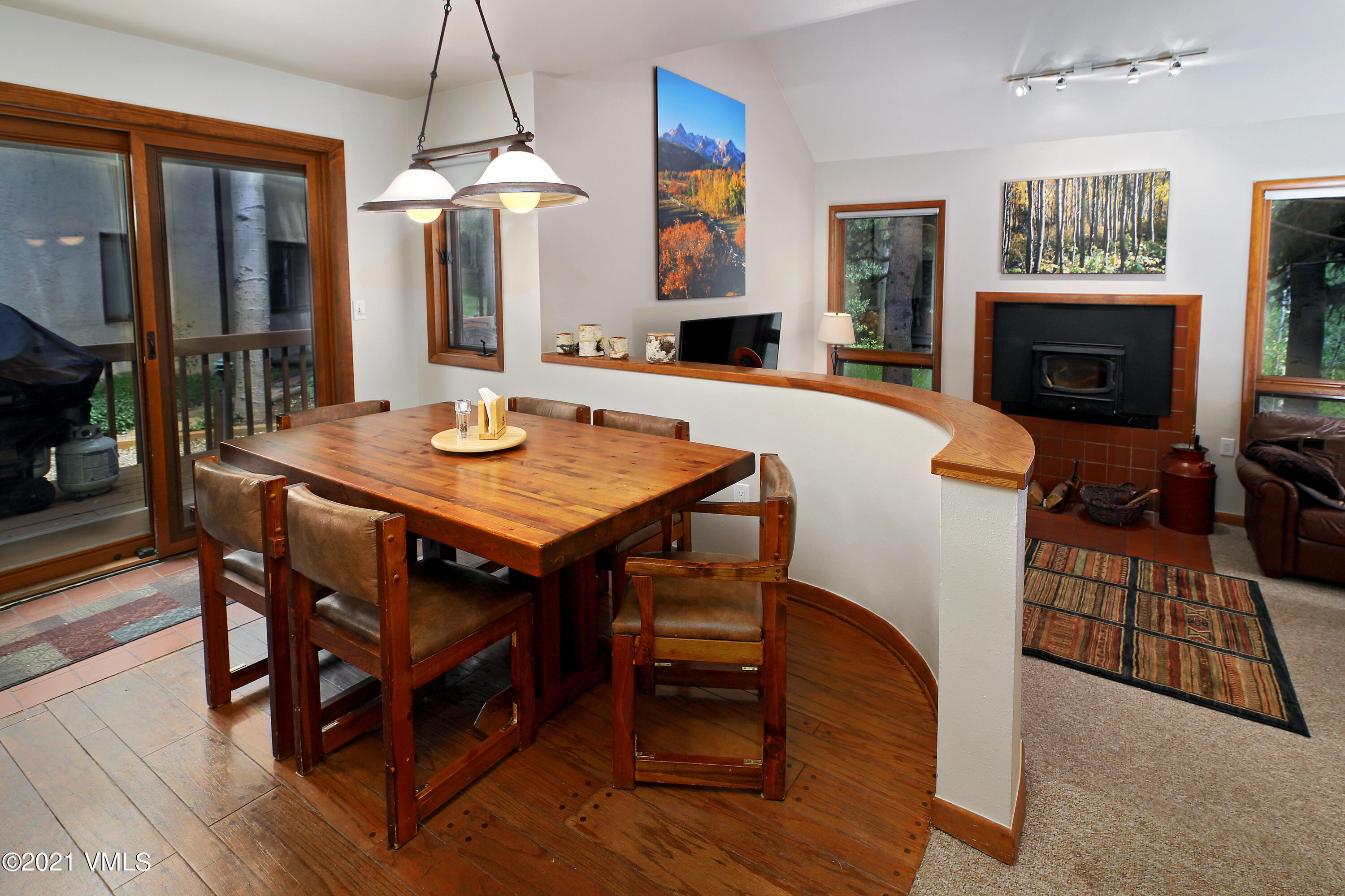 1480 Buffehr Creek Road, Unit 3A Vail, CO 81657 - Photo 3 of 17 a view of a dining room with furniture window and wooden floor