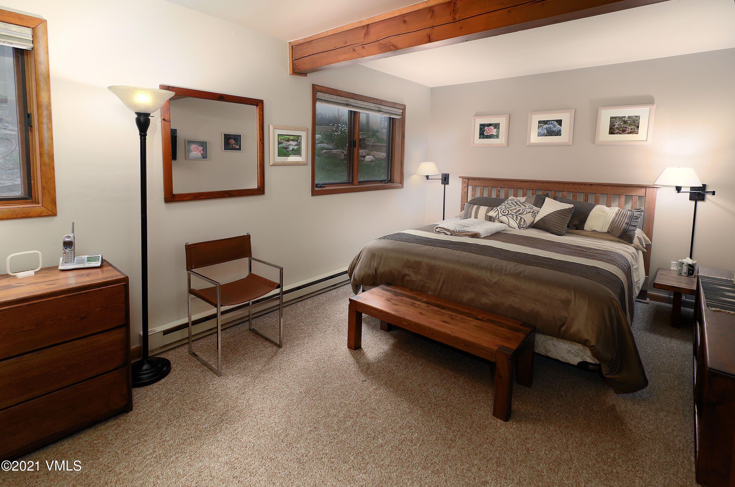 1480 Buffehr Creek Road, Unit 3A Vail, CO 81657 - Photo 8 of 17 a spacious bedroom with a bed and window