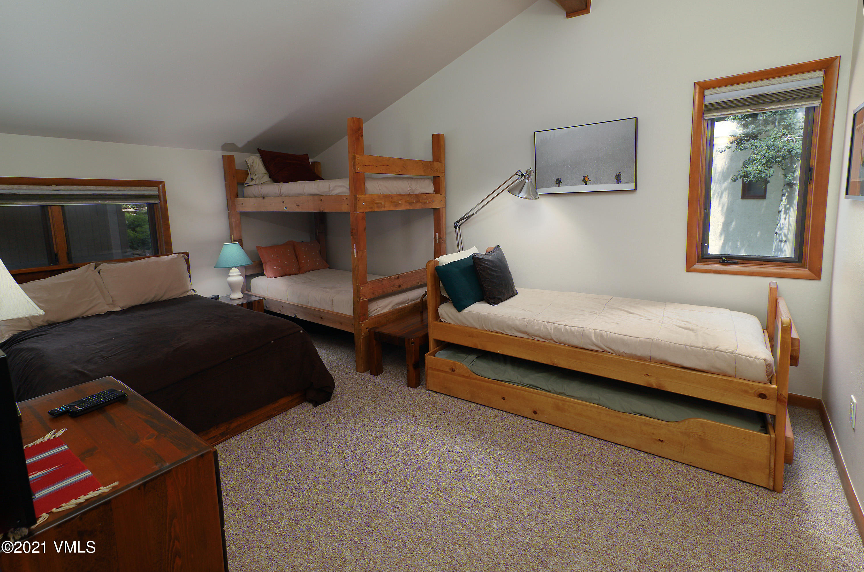 1480 Buffehr Creek Road, Unit 3A Vail, CO 81657 - Photo 10 of 17 a bedroom with a bed and window