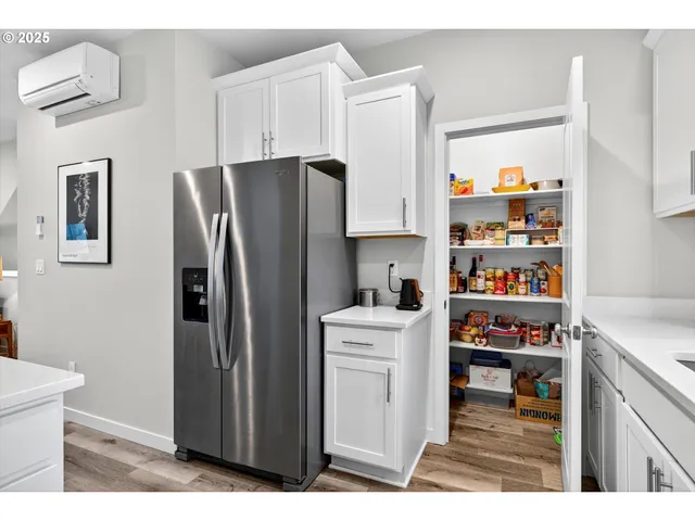 a kitchen with stainless steel appliances a refrigerator and a stove