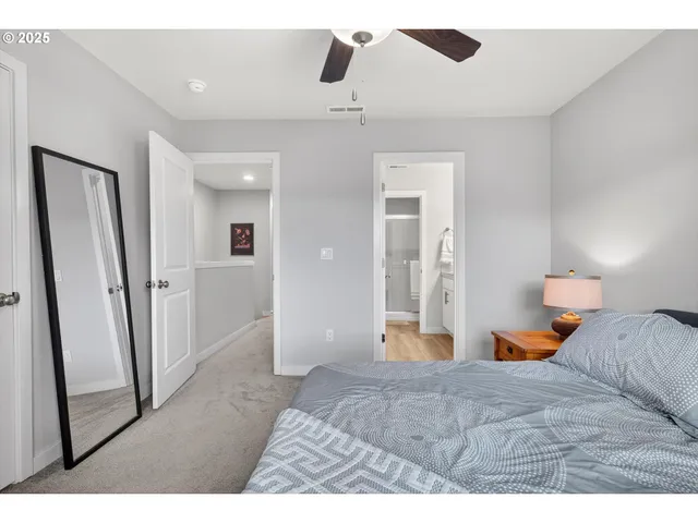 a bedroom with a bed and a walk in closet