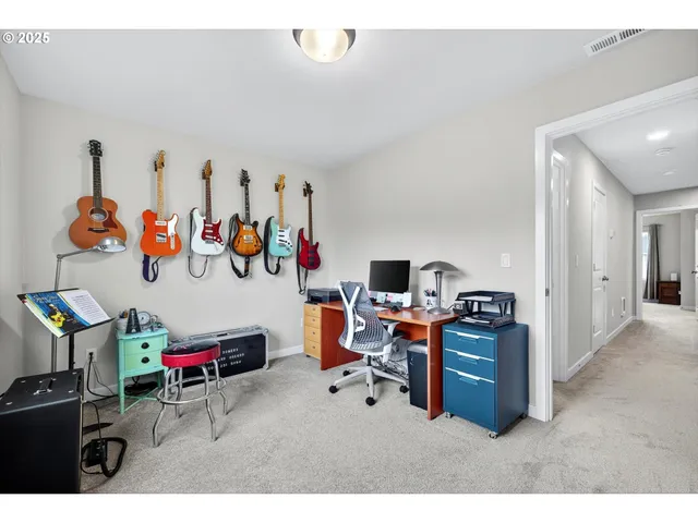 a view of a workspace with furniture