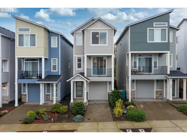 a view of a house with wooden fence