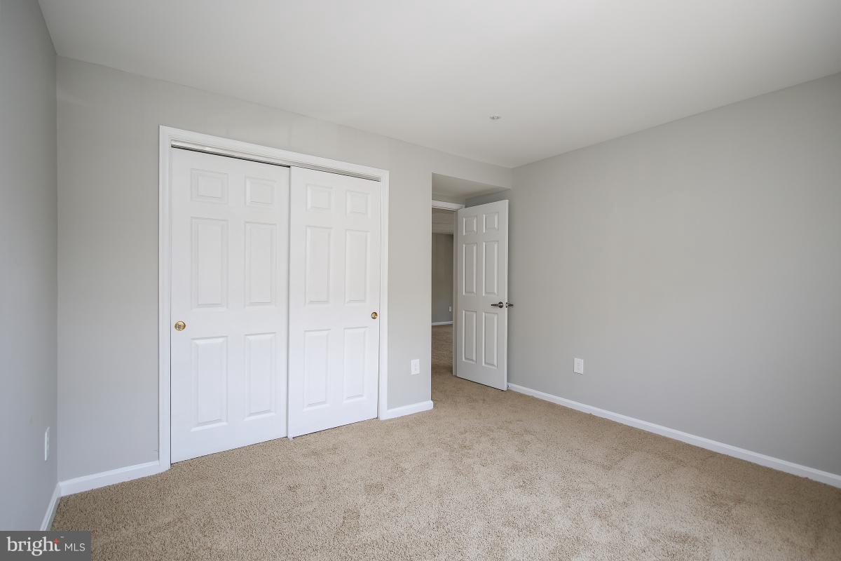 402 Ridgepoint Place, Unit 28 Gaithersburg, MD 20878 - Photo 14 of 29 a view of an empty room and closet area
