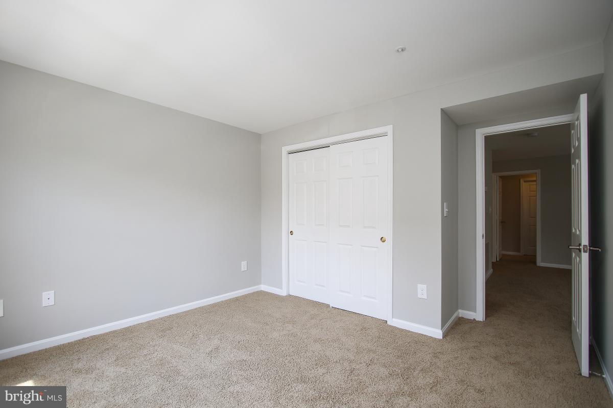 402 Ridgepoint Place, Unit 28 Gaithersburg, MD 20878 - Photo 15 of 29 a view of an empty room and closet