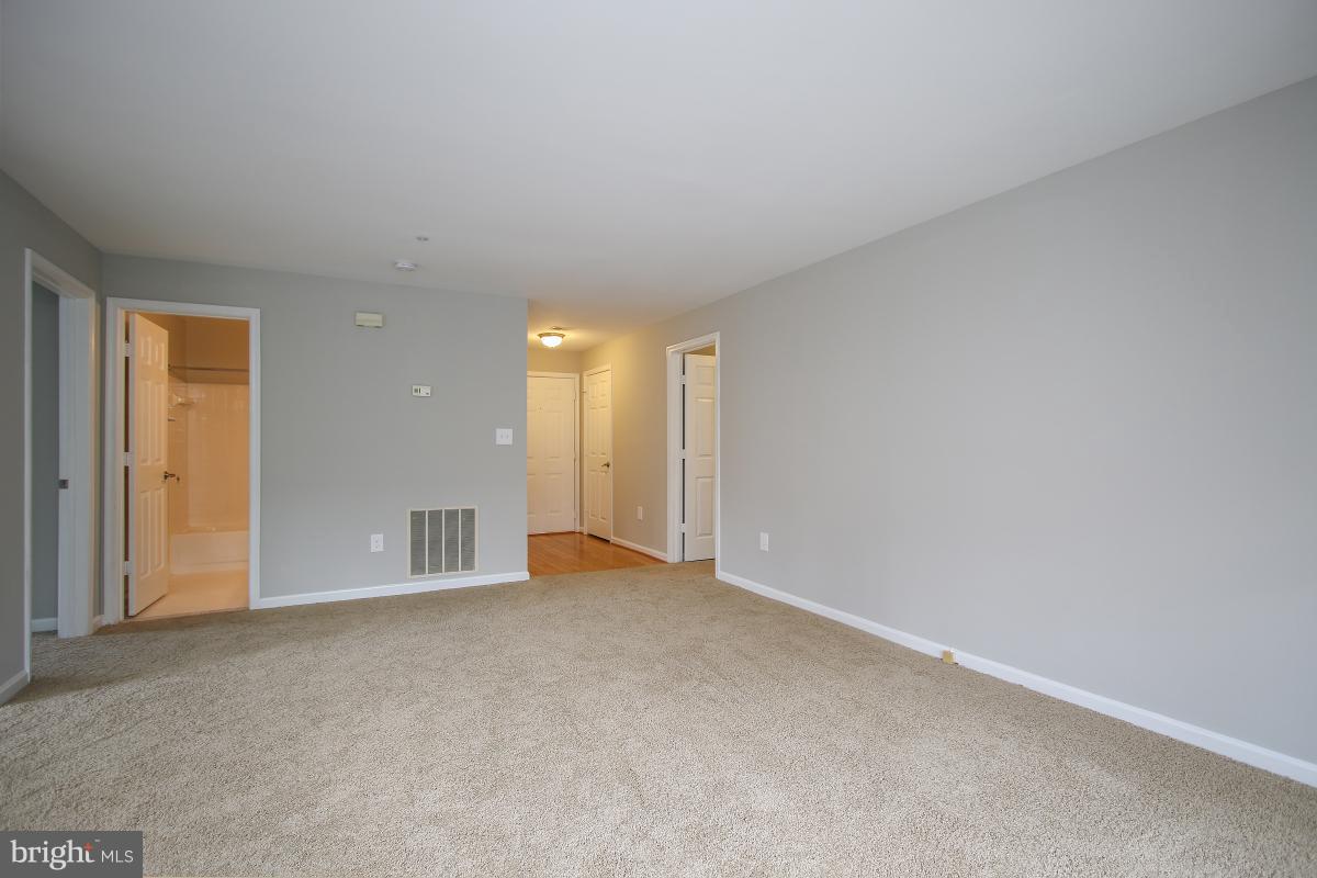 402 Ridgepoint Place, Unit 28 Gaithersburg, MD 20878 - Photo 4 of 29 a view of empty room