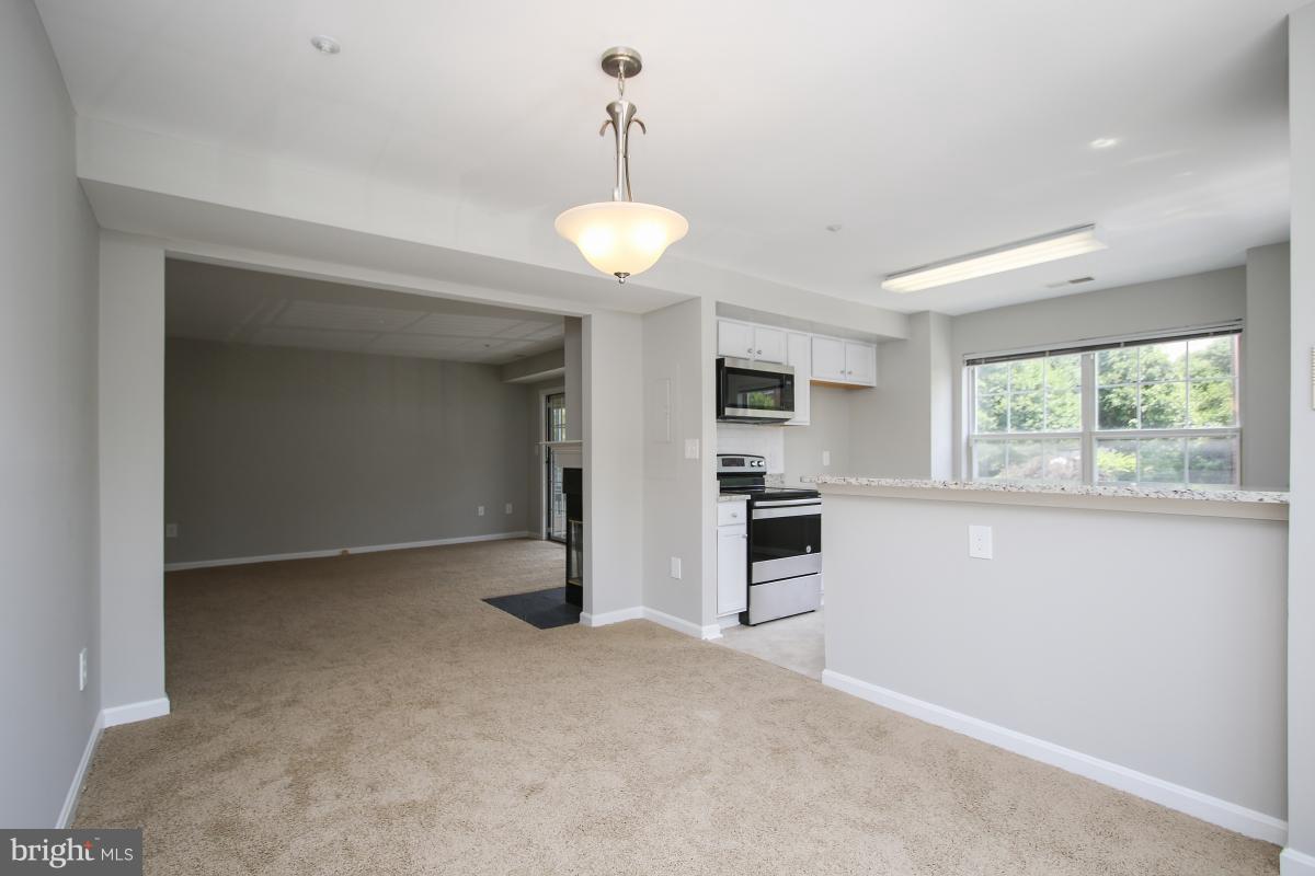 402 Ridgepoint Place, Unit 28 Gaithersburg, MD 20878 - Photo 7 of 29 a view of a room with a flat screen tv