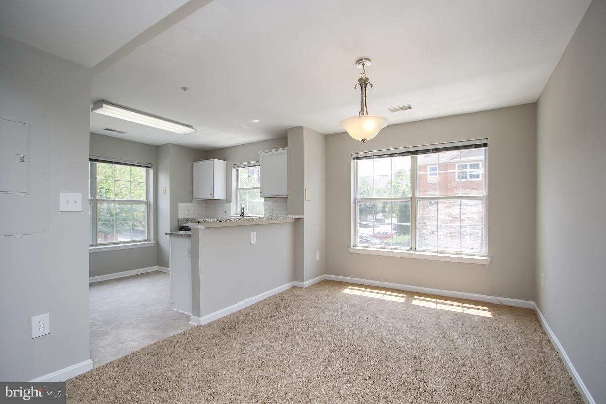 402 Ridgepoint Place, Unit 28 Gaithersburg, MD 20878 - Photo 8 of 29 a view of an empty room with a window