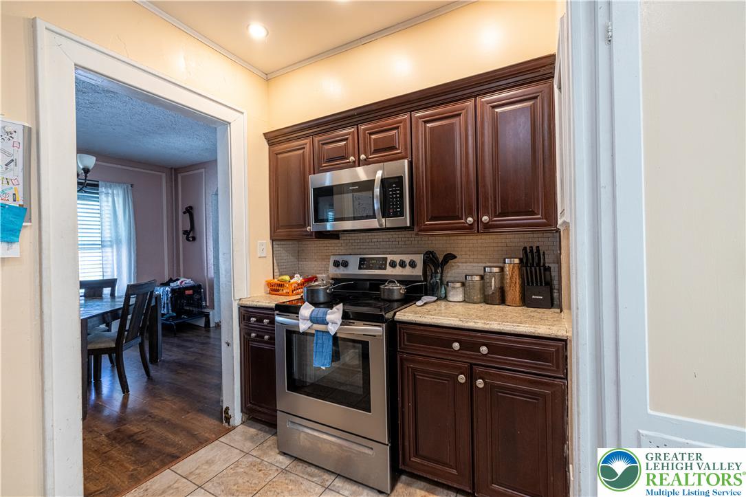 118 South 3rd Street Bangor, PA 18013 - Photo 6 of 33 This kitchen boasts ample cabinet space and modern stainless steel appliances.
