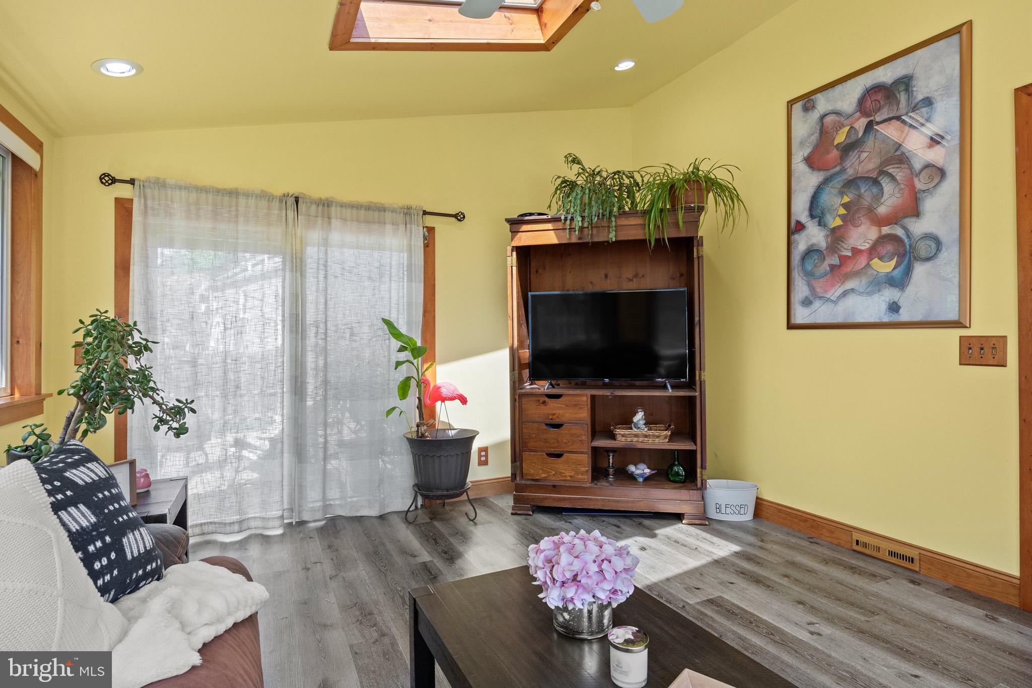50 Miry Brook Road Hamilton, NJ 08690 - Photo 15 of 28 a living room with furniture and a flat screen tv