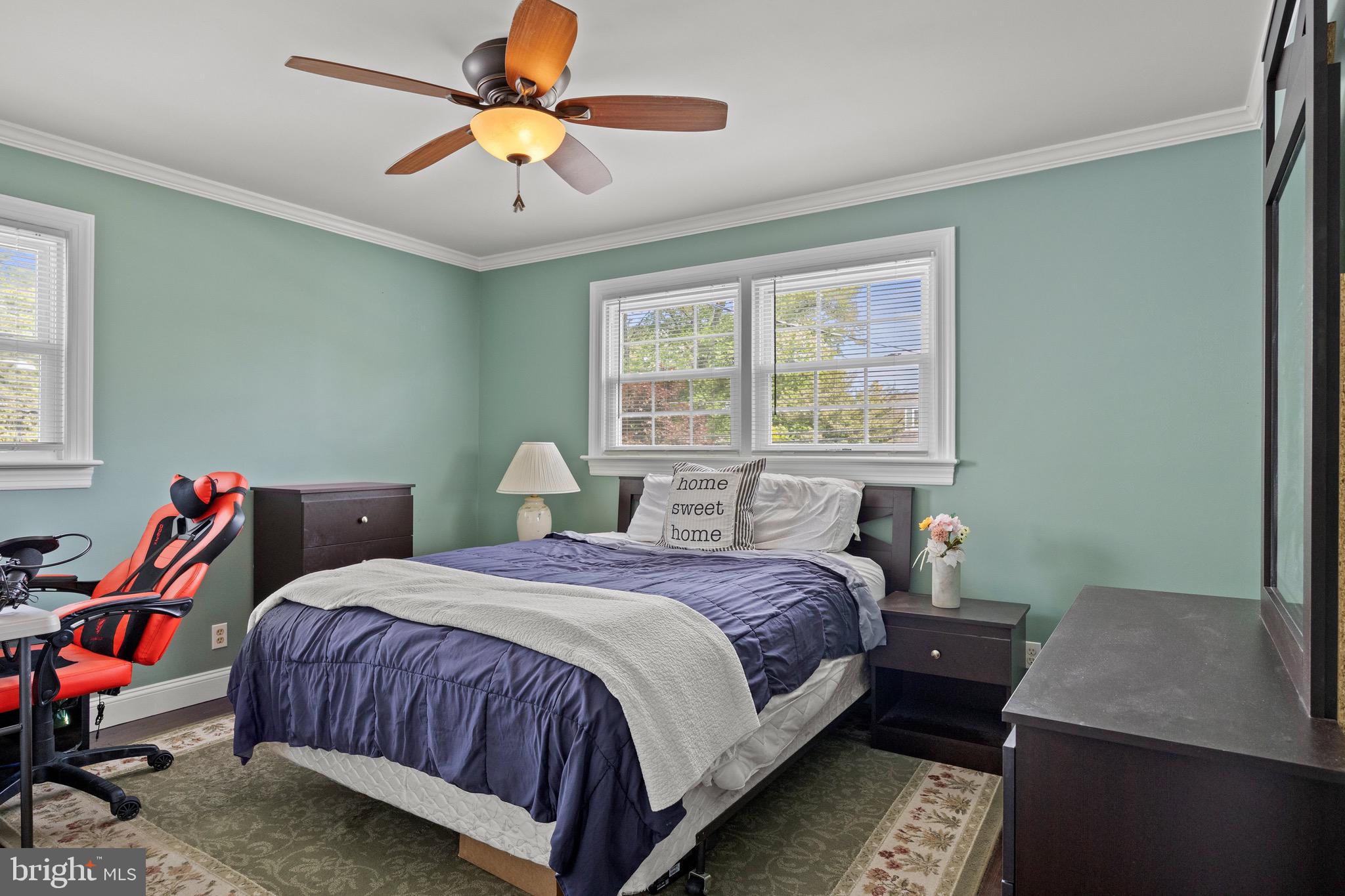 50 Miry Brook Road Hamilton, NJ 08690 - Photo 16 of 28 a bedroom with a bed and a chandelier