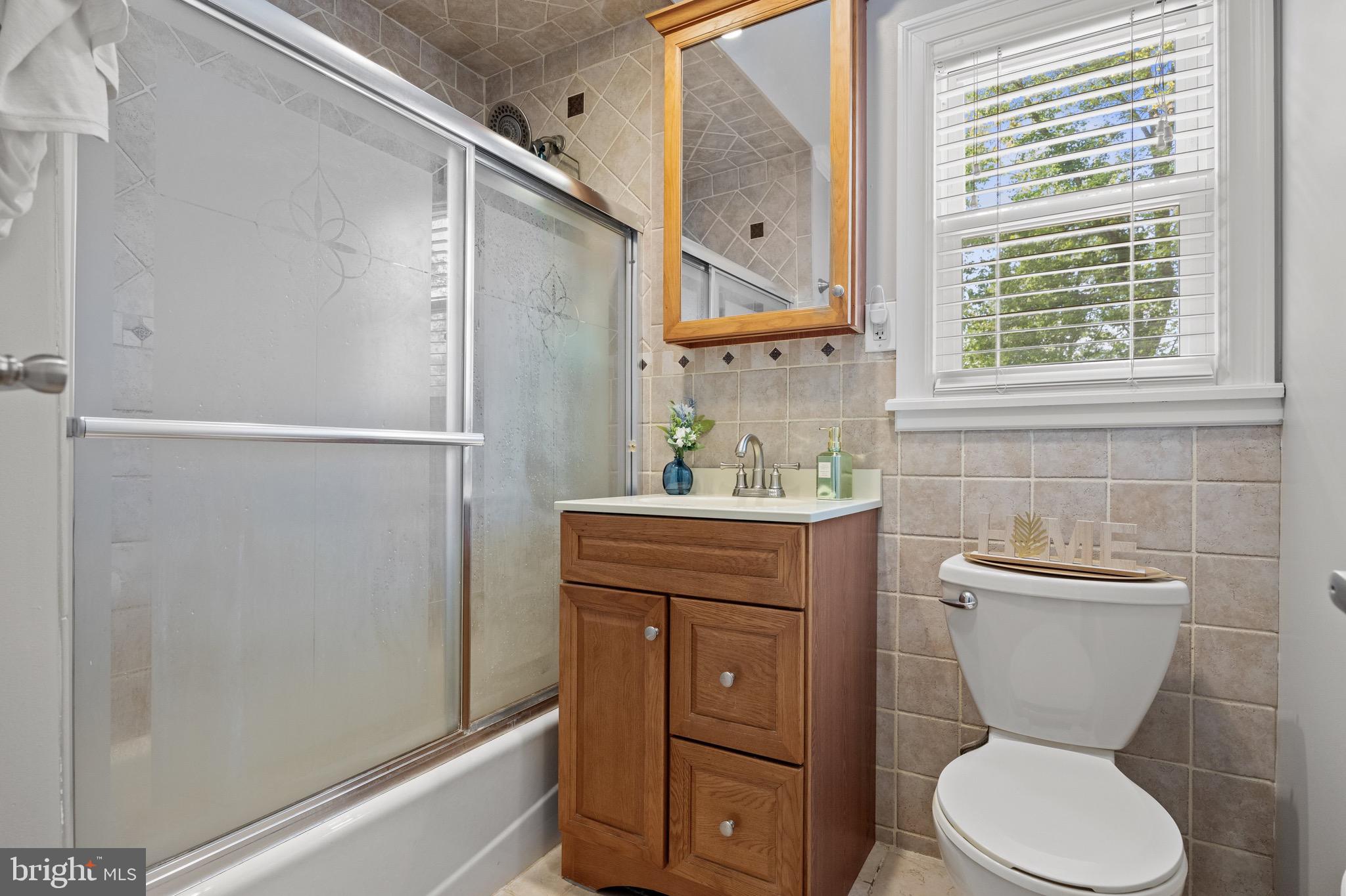 50 Miry Brook Road Hamilton, NJ 08690 - Photo 18 of 28 a bathroom with a toilet sink and mirror