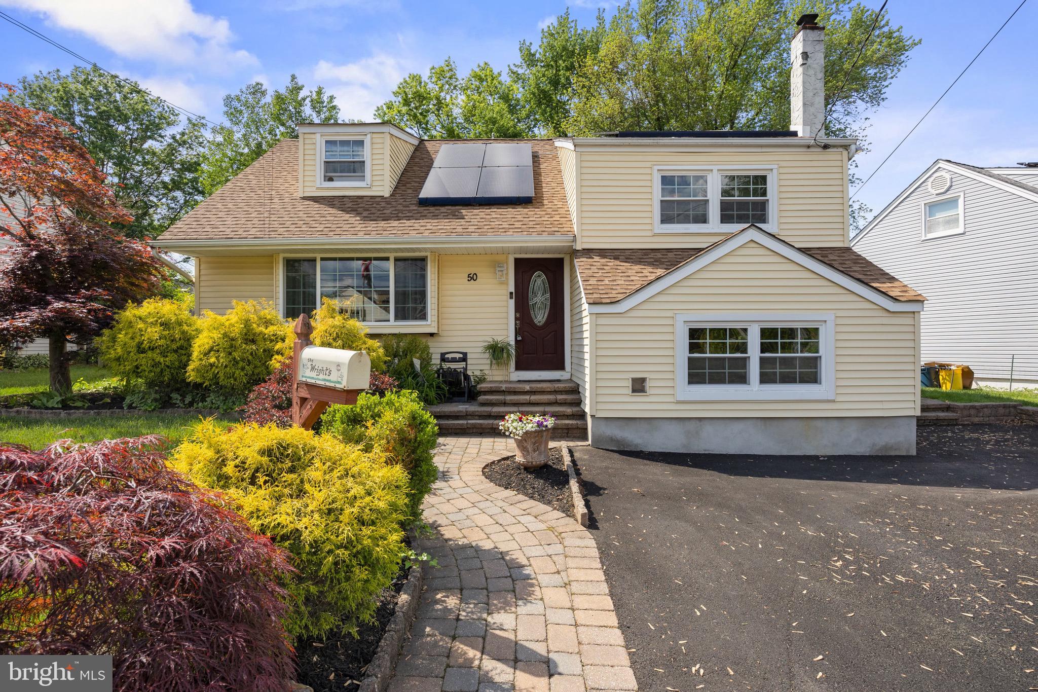 50 Miry Brook Road Hamilton, NJ 08690 - Photo 2 of 28 a front view of a house with a yard and outdoor seating
