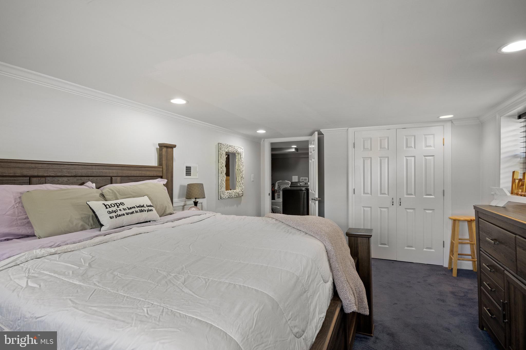 50 Miry Brook Road Hamilton, NJ 08690 - Photo 25 of 28 a large bedroom with a bed and a fireplace