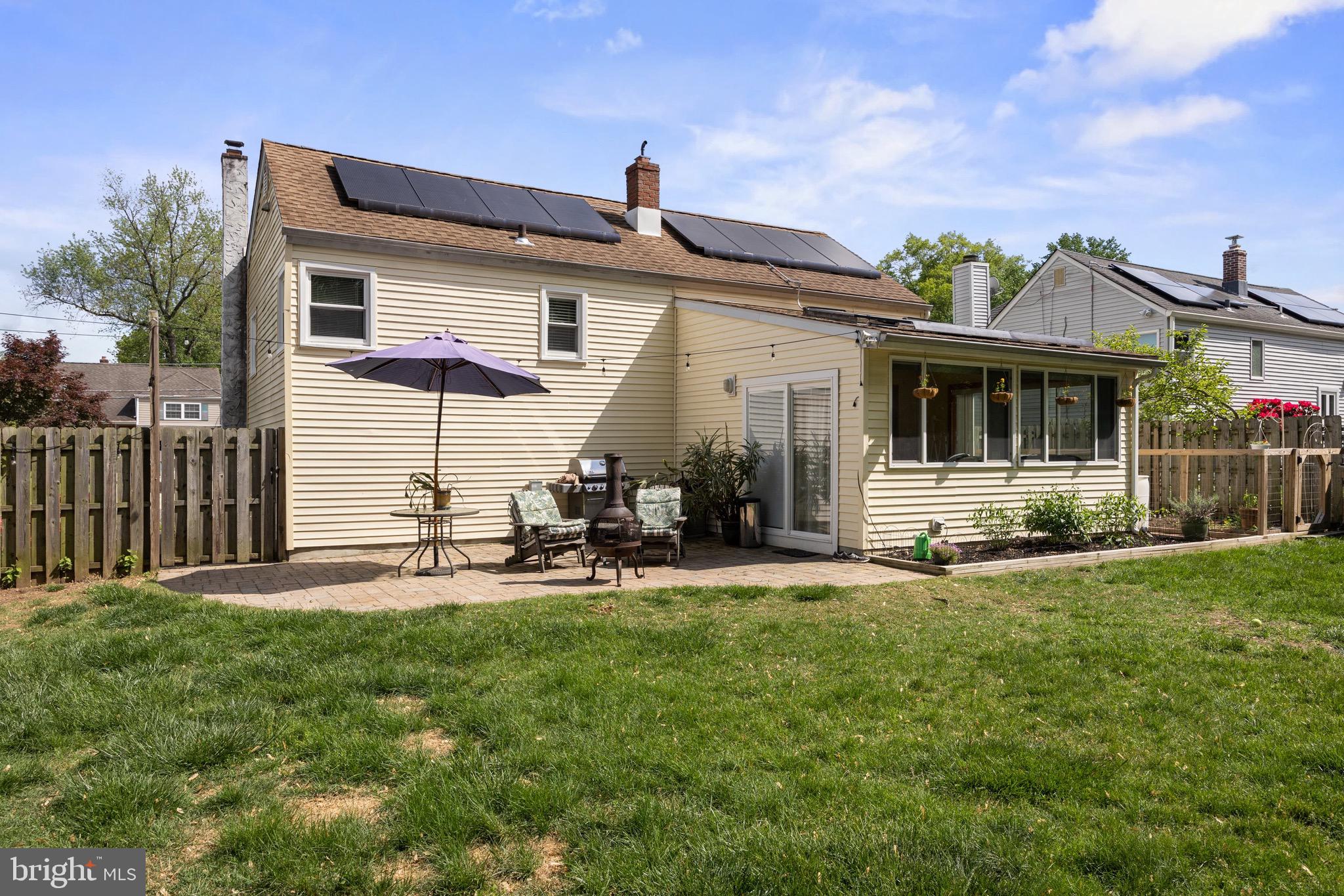 50 Miry Brook Road Hamilton, NJ 08690 - Photo 26 of 28 a front view of a house with patio and a yard