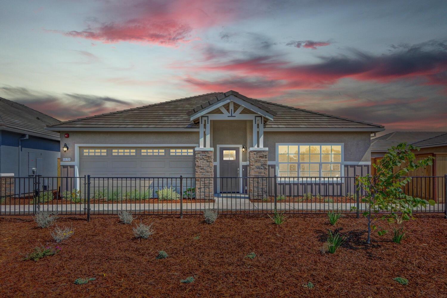 a view of a house with a fence