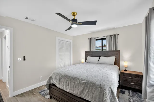 a bedroom with a bed and a dresser