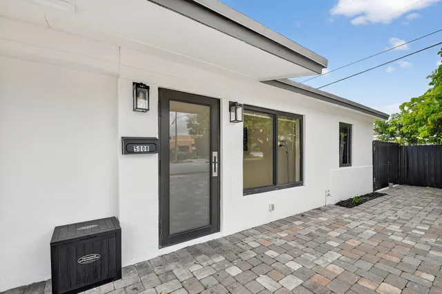 a view of house with backyard