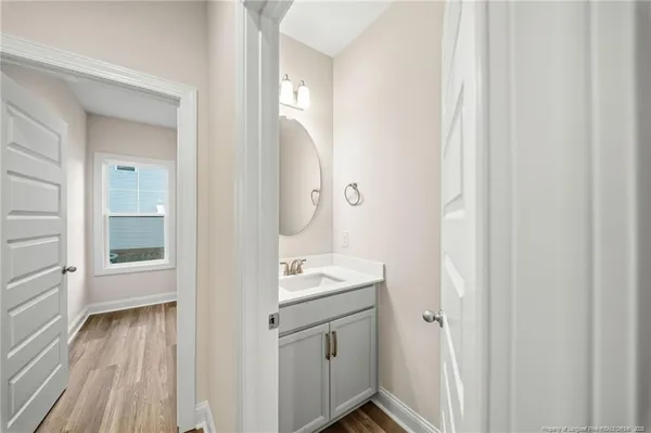 a bathroom with a sink a mirror and a shower