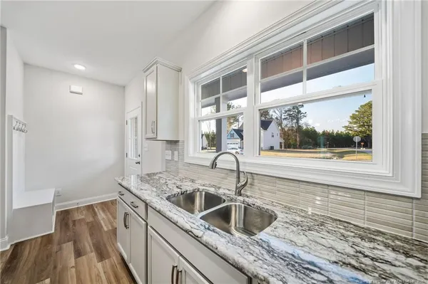 a kitchen with a sink and a window
