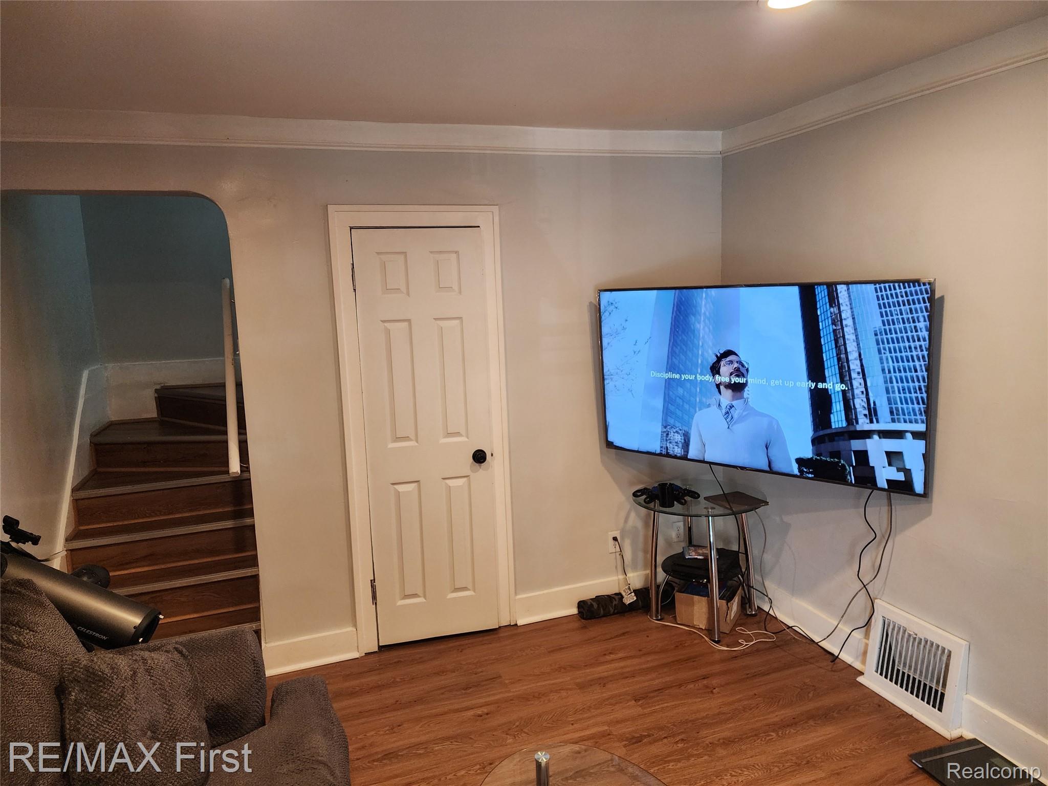 19345 Keystone Street Detroit, MI 48234 - Photo 5 of 15 Office featuring dark wood-style flooring, arched walkways, and crown molding