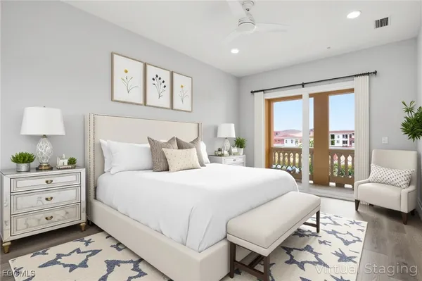 a bedroom with a large bed and a couch