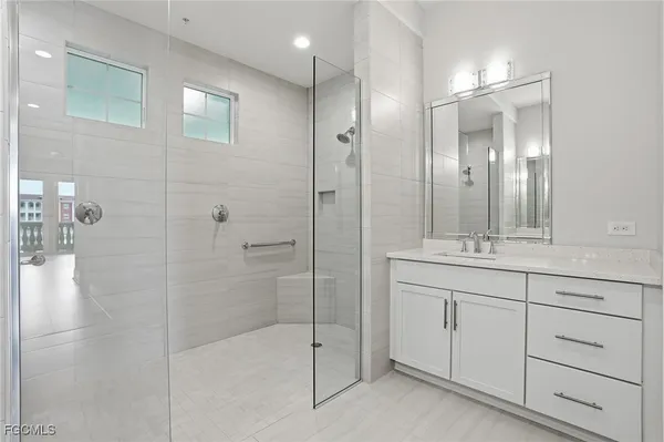 a bathroom with a shower and a sink