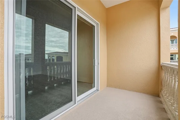 a view of hallway with sliding door and couch