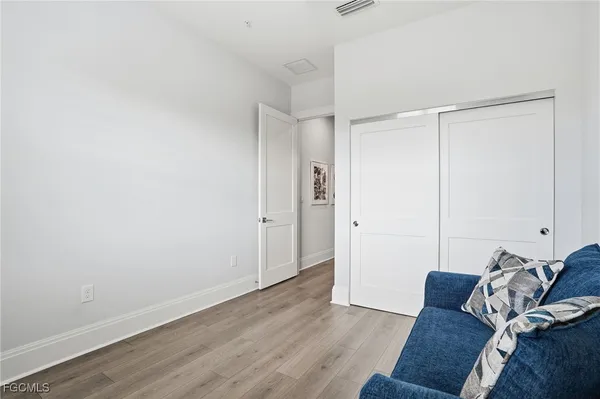 a view of a livingroom with wooden floor